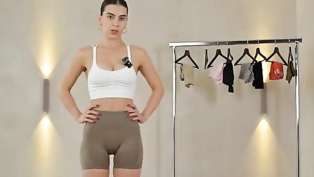 Fit brunette in tight gym shorts and crop top, activewear try-on haul