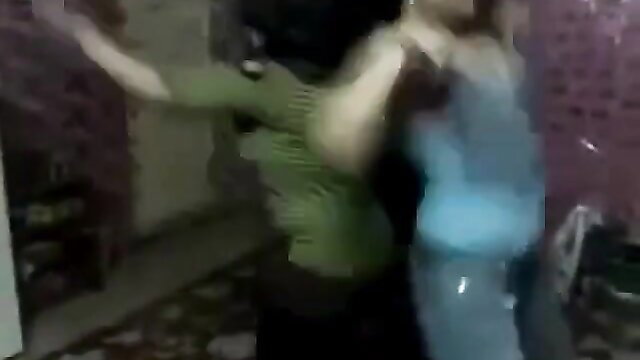 Indonesian MILF in green top grabs blue-dressed woman intimately