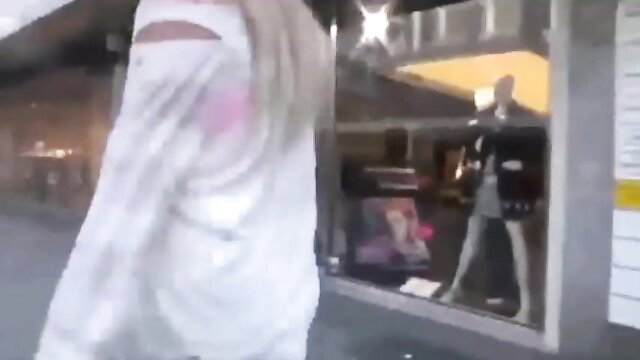 Veiled blonde babe in niqab and abaya outside store window