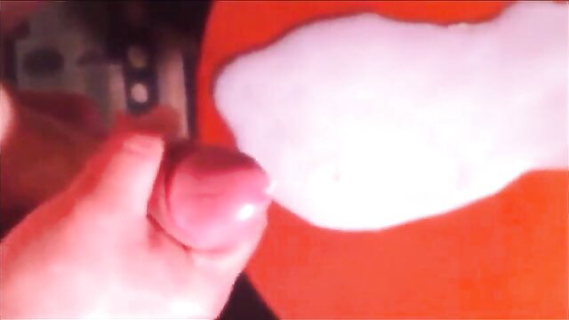 Sissy slut penis with thick cum load on orange plate closeup