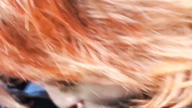 Anorexic street whore closeup with messy red hair and smeared makeup