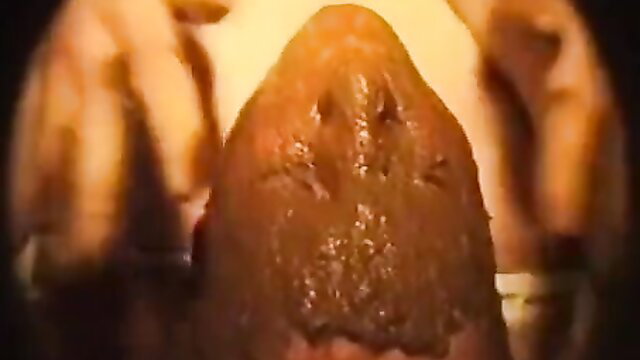 Extreme closeup of woman's smeared scat-covered face in German fetish video