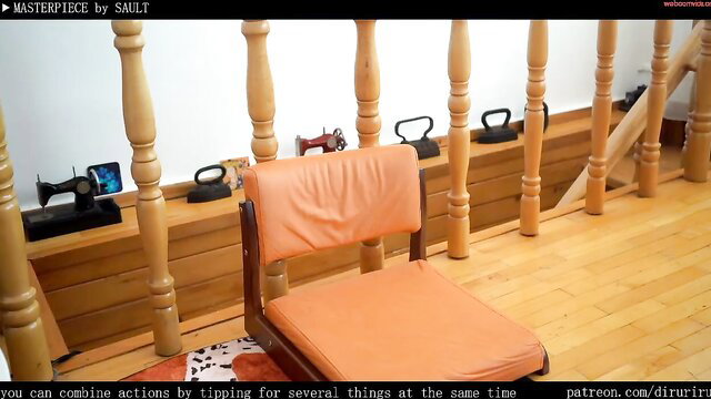 Ms Dira nude in orange chair showing shaved pussy closeup