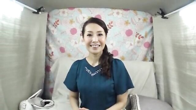 Woman in blue top speaking or presenting