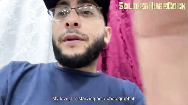 Man speaking to camera, possibly discussing financial struggles as a photographer