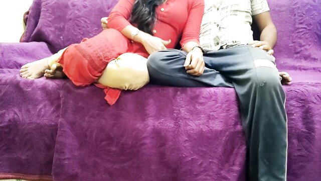 Mumbai Ashu in red top with hubby on purple couch, feet out