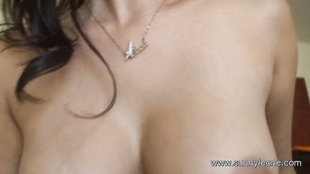 Sunny Leone topless tease showing big tits closeup