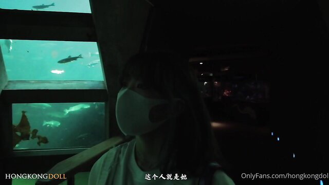 Asian doll in mask at aquarium, sexy amateur thumbnail
