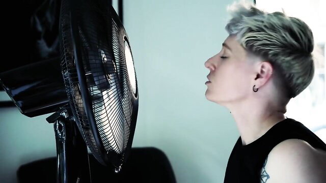 Jaq Quicksilver blowing hot on fan in tank top FtM tease