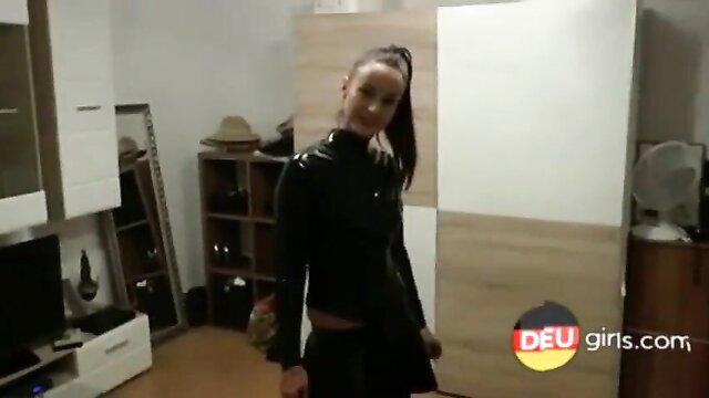 Hot German girl in shiny black latex dress posing sexy