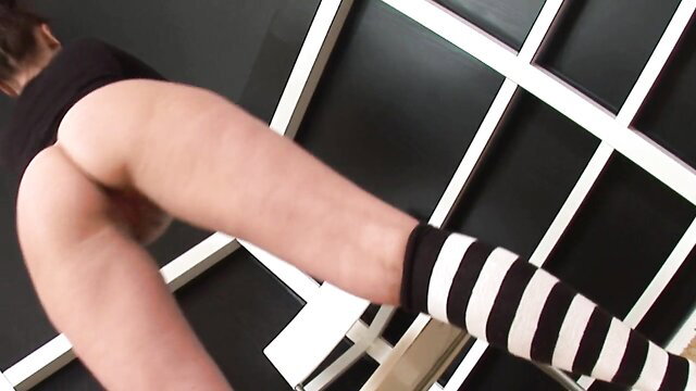 Hot brunette bends over exposing wet pussy and big ass in striped socks