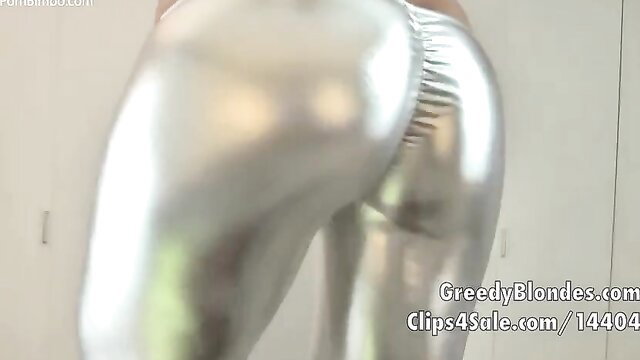 Shiny silver leggings hugging curvy blonde's big ass in solo tease