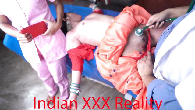 Indian nurse checks desi patient's bare chest with stethoscope in clinic