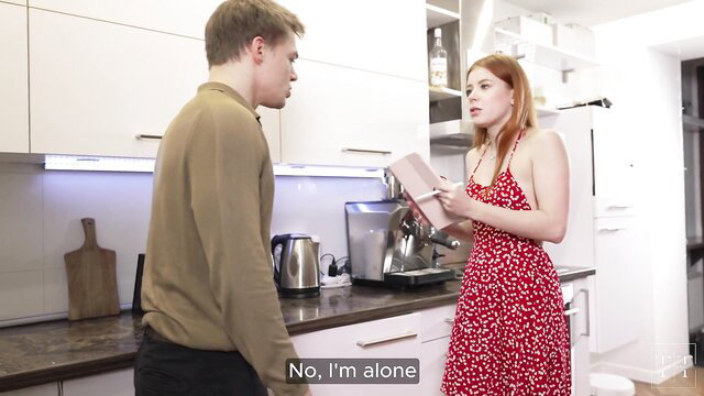 Redhead Tim Deen in red dress flirts with guy in kitchen apartment rental