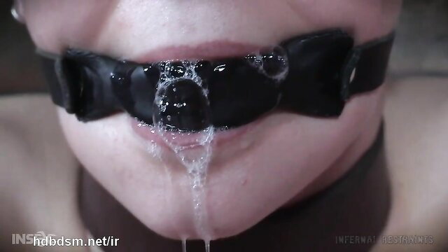 Short-haired brunette gagged with drool after flogging nipple punishment