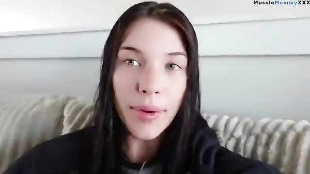 Asian muscle mommy with wet black hair in hoodie, sexy lip piercing closeup
