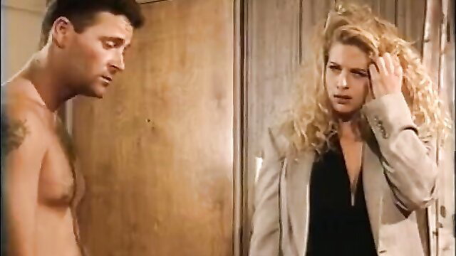 Curly-haired blonde in suit fucked by shirtless tattooed hunk