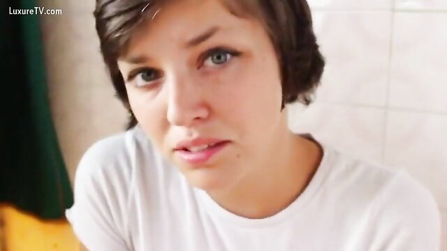 Emma Chase closeup face in white tee, sultry gaze