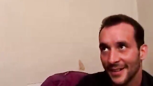 Smirking young guy in dimly lit room, ready for steamy assfuck pickup