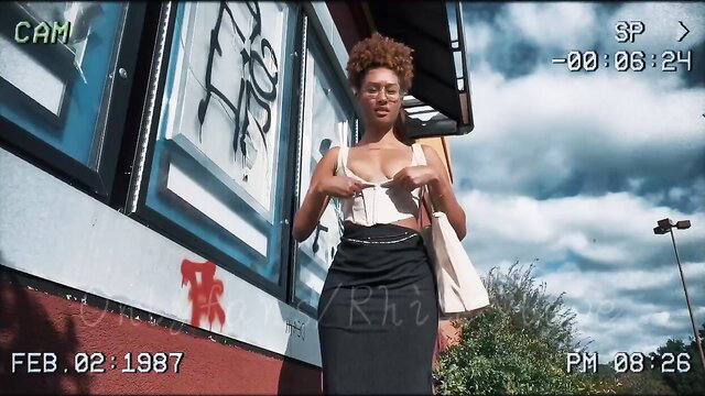 Curvy black babe Cami flashes huge tits outside theater in sexy skirt