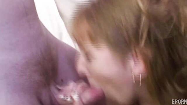 Vintage MILF with red hair sucking cock in gangbang scene