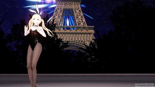 Blonde bunny girl in black slingshot bikini dances sexy at Eiffel Tower night
