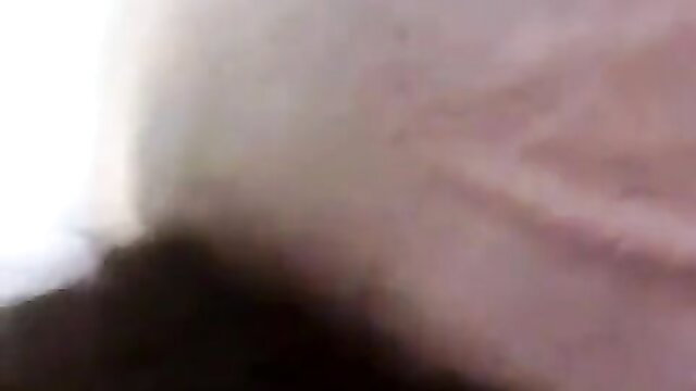 Blurry closeup of nude woman with pale skin and light hair in adult video