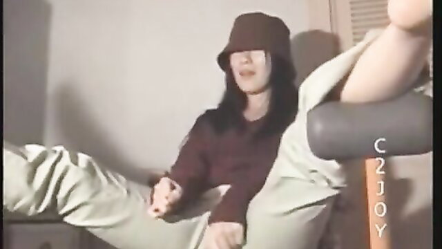 Asian woman in bucket hat and baggy pants on love electric chair
