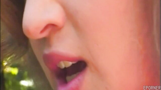 Closeup of young Asian woman's open mouth in vintage lesbian outdoor porn