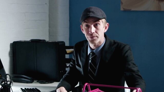 Blonde seduces suited colleague at desk in steamy office tease