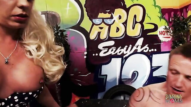 Blonde MILF with huge tits fucked by man near ABC Easy As graffiti