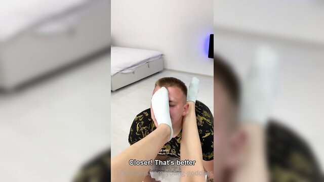 Young Goddess 7 dominates man with white socks smothering his face up close