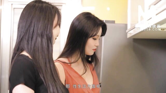 Autumn Knight and friend in kitchen, tight dress, seductive pose