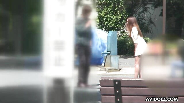 Ai Koda in white mini dress bending over outdoors, hot upskirt view