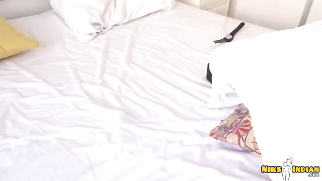 Hot Indian babe on messy bed in lingerie, teasing pose