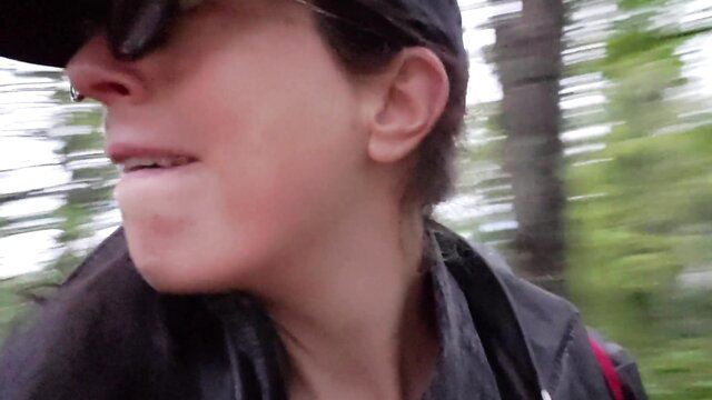 Alex sweaty face in woods, sunglasses hat, wet lips outdoor tease