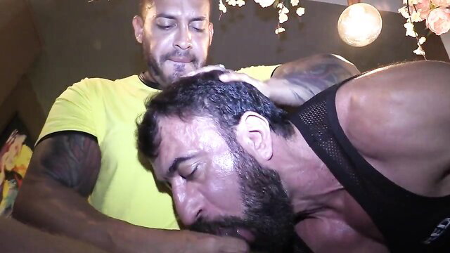Tattooed Latino daddy facefucks bearded hunk in intense bar session