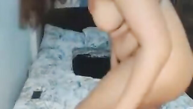 Breasty tranny lass nude on bed showing curves and big tits