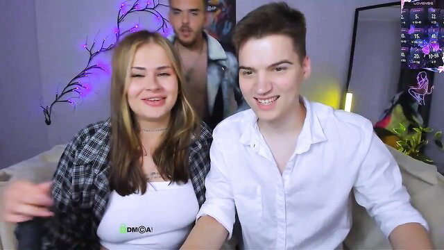 Ash Raven camgirl with two guys on couch, blonde amateur Chaturbate tease