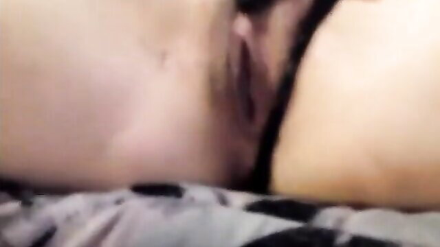 Closeup of horny amateur girl's wet shaved pussy in black lingerie