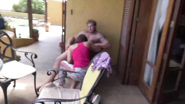 Blonde stud fucks brunette Alexis Cherry outdoors on chair