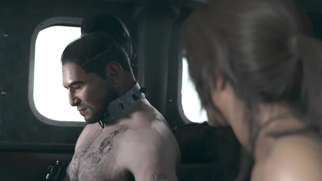 Lara Croft with shirtless tattooed man in collar on helicopter