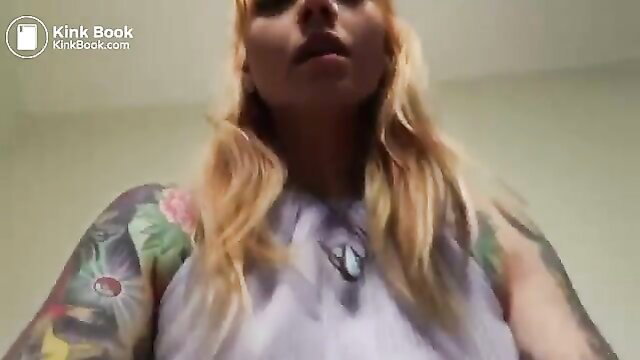 Phat ass tattooed blonde babe with huge tits smirking closeup