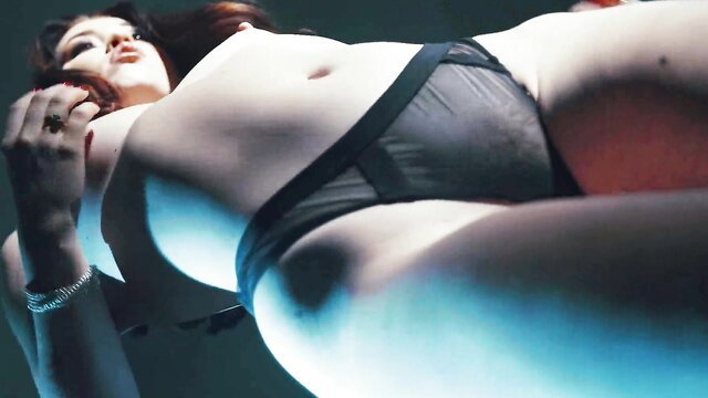 Redhead nude beauty in sheer black lingerie, fetish explicit pose