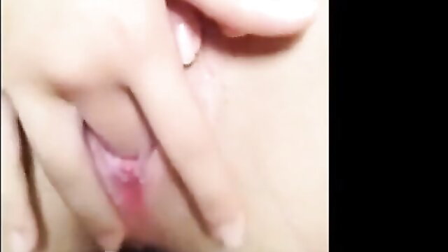 Closeup of young woman fingering shaved pink pussy lips