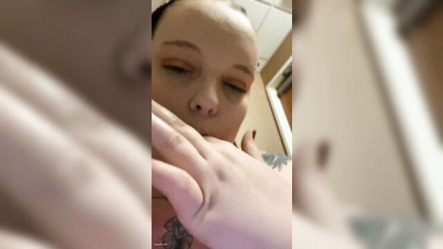 Fat slut Willow licks hand in public work toilet closeup