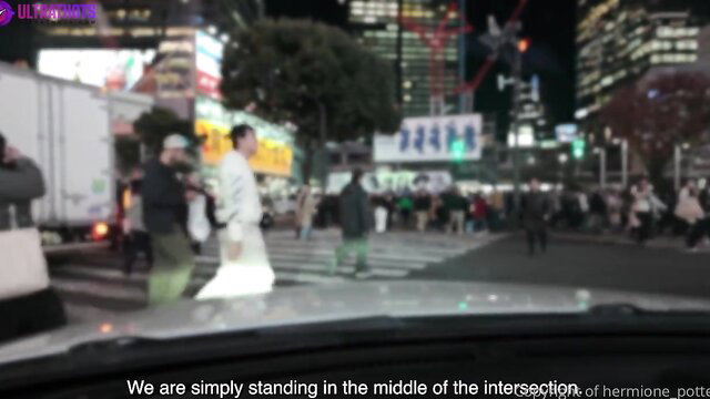 Hermione Potter stands in Tokyo crosswalk at night, Nissan Skyline BJ video thumbnail