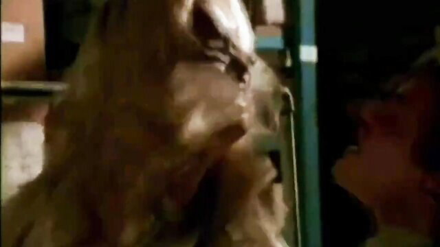 Blonde masseuse with huge tits giving erotic oily massage closeup