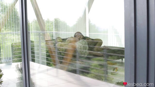 Elegant lesbian threesome with sensual chicks on couch