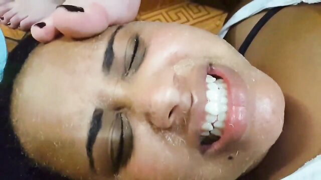 Pandora Cruel close-up foot smother on face, soles worship in fetish video